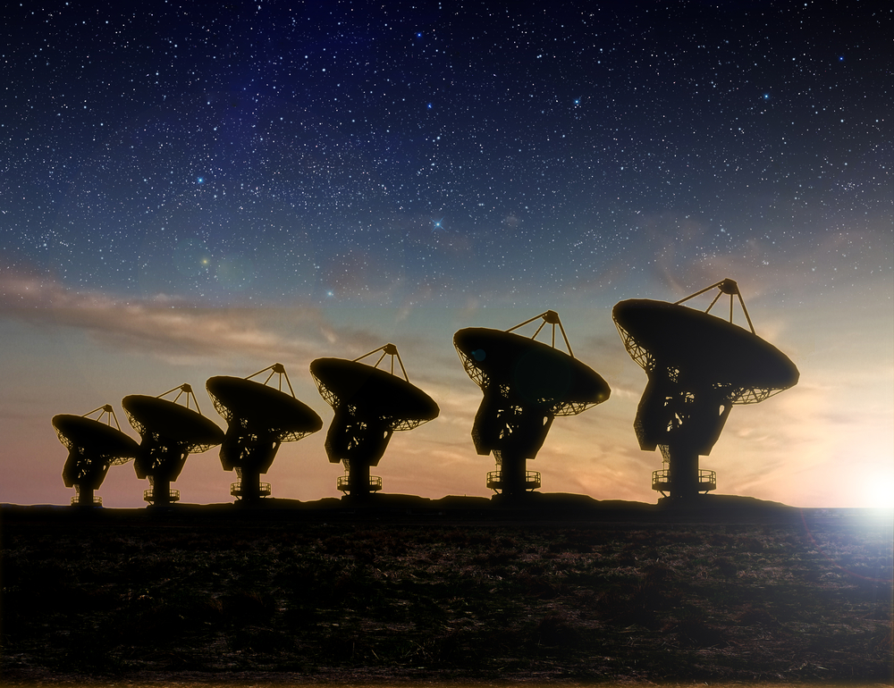 Radio telescopes point toward the night sky