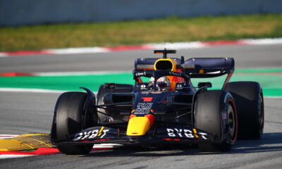 Close-up of Max Vestappen's Red Bull Racing car doing a lap of the track